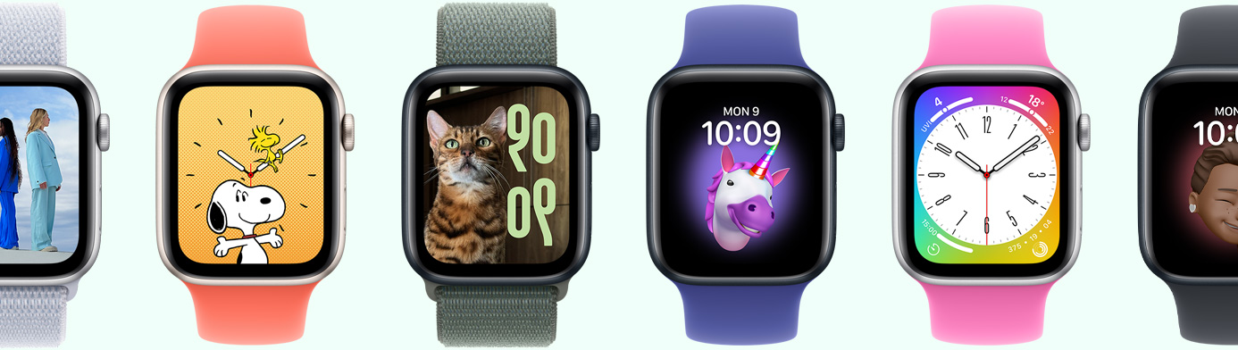 Multiple Apple Watch devices showing various watch face options
