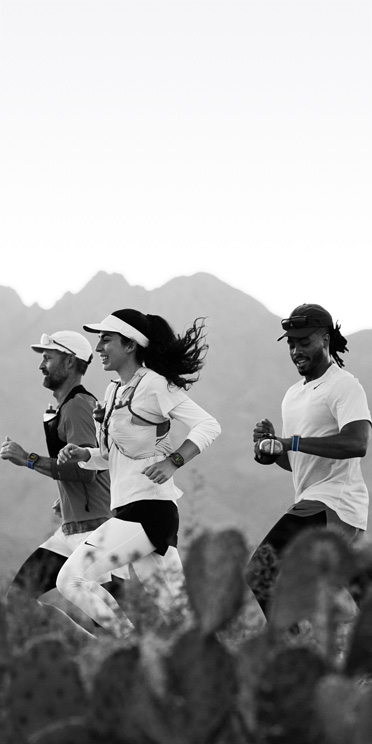 Runners on a desert trail track their workouts on Apple Watch Ultra 3