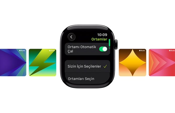 Ortadaki kayışsız Simsiyah Apple Watch'un kadranında “Senin İçin Seçildi” ve “Medya Seç” seçenekleri, üstte yeşil harflerle Bisiklet (Dış) yazısı, arka planda özel Apple Music duvar kağıtları yer alıyor